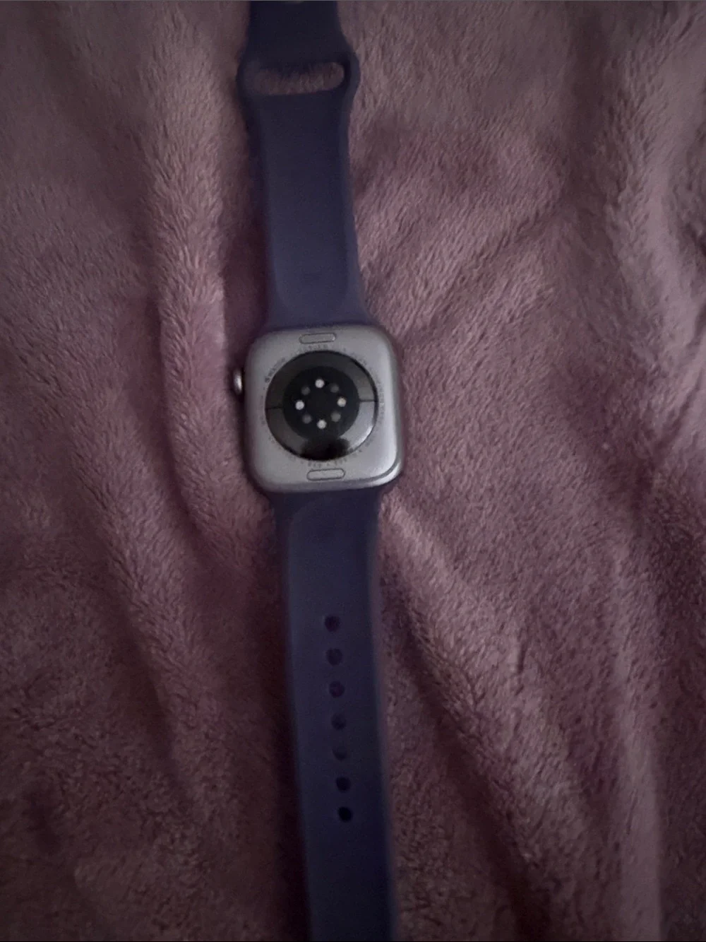 Apple Smartwatch Series 8 with purple silicone watch and